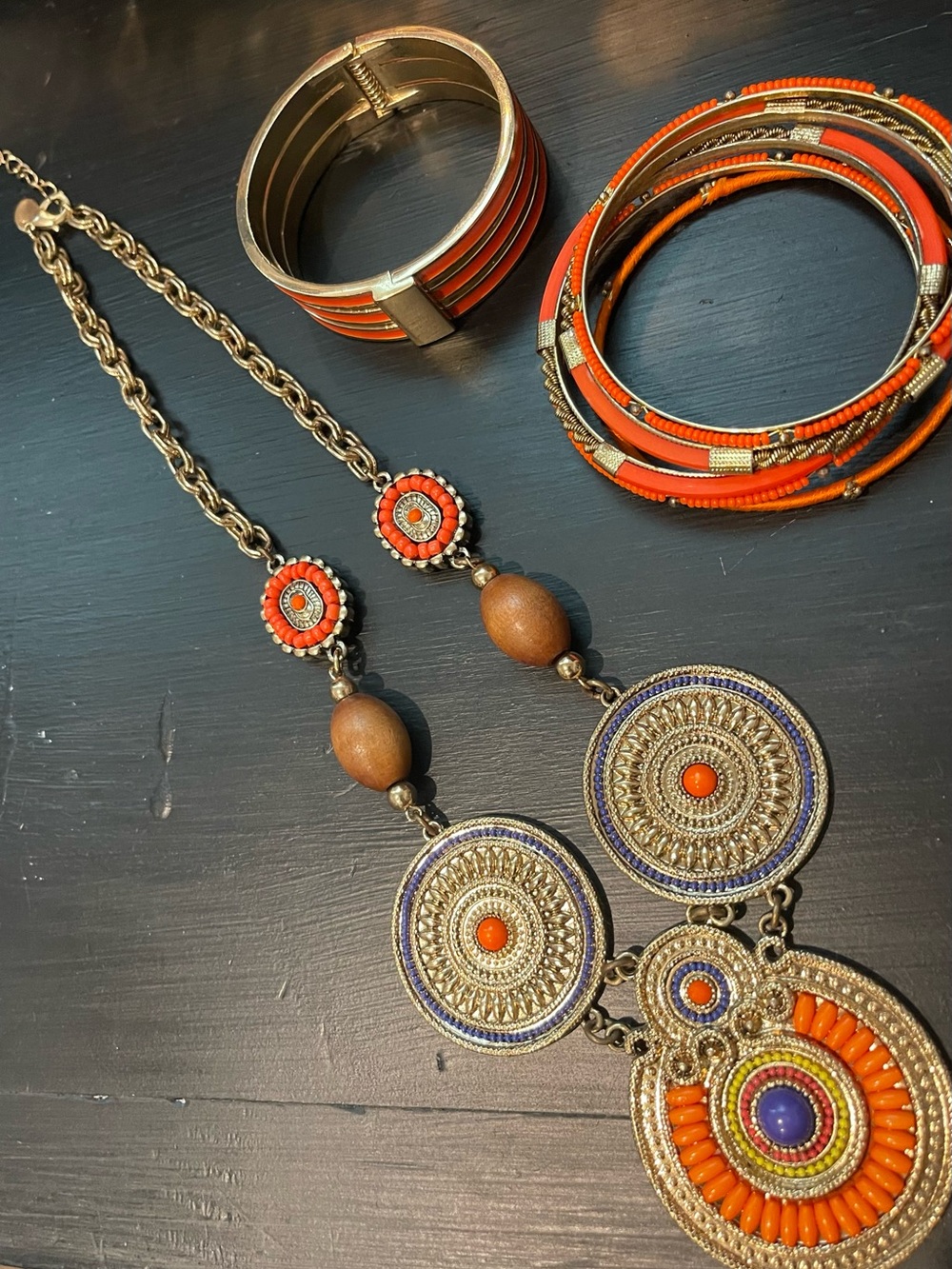 Artisan Orange and Gold Medallion Pendant Necklace and bracelets